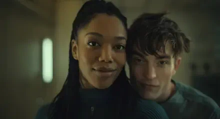 Robert Pattinson and Naomi Ackie share a moment in this HD desktop wallpaper from the movie Mickey 17 (2025), showcasing a captivating connection between their characters.