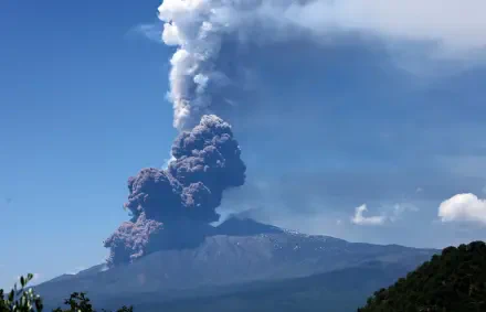 Eruption of a volcano in Sicily sending a towering ash cloud into the sky, captured in stunning 8K Ultra HD quality.