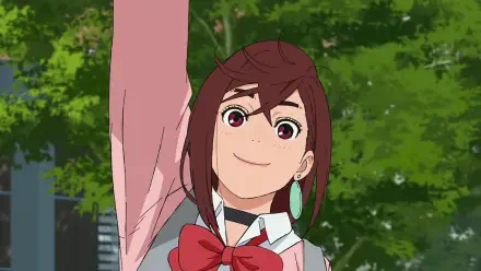 HD anime desktop wallpaper featuring Momo Ayase from Dandadan, smiling brightly with a raised arm against a lush green background.