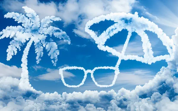 A vibrant summer vacation scene with fluffy clouds shaped like palm trees, sunglasses, and an umbrella against a bright blue sky, designed as a 4K Ultra HD desktop wallpaper.