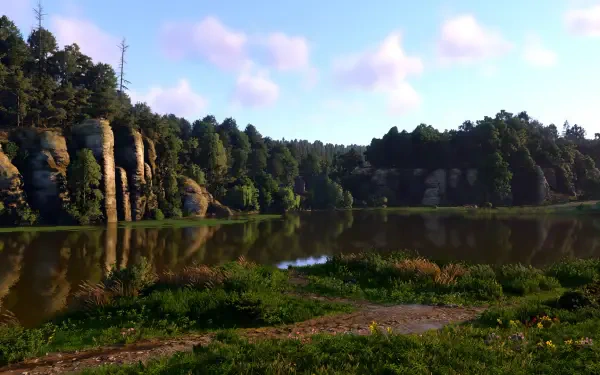 A serene lake surrounded by lush greenery and rocky cliffs, showcasing the vibrant nature found in Kingdom Come: Deliverance II. This HD image serves as a stunning desktop wallpaper.