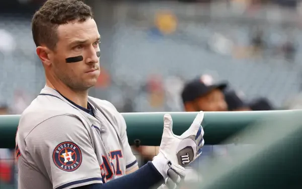 Alex Bregman of the Houston Astros prepares for action, showcasing his determination in a high-definition baseball moment. Ideal HD wallpaper for MLB fans.