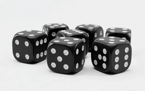 A collection of black dice with white spots, arranged artistically, presented as a 4K Ultra HD PC desktop wallpaper and background.
