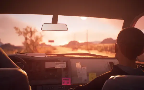 A scene from Life Is Strange 2, featuring a character in a car looking out the window at a picturesque sunset over a desert landscape, serving as an HD PC desktop wallpaper.