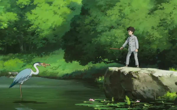 HD PC wallpaper from Studio Ghibli’s anime The Boy and the Heron, depicting a boy standing on a rock by a pond with a heron in a lush green forest.