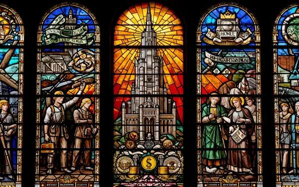 A 4K Ultra HD PC desktop wallpaper featuring a stained glass window themed around capitalism, depicting industrial and financial symbols with vibrant colors and intricate detail.