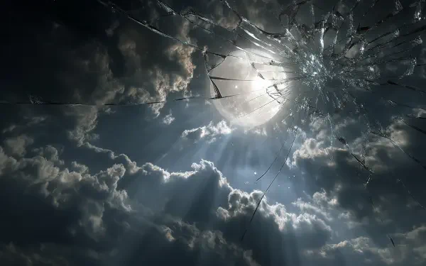 HD PC wallpaper showing a bright moon and clouds through a broken screen, creating a striking contrast between the shattered glass and the night sky.
