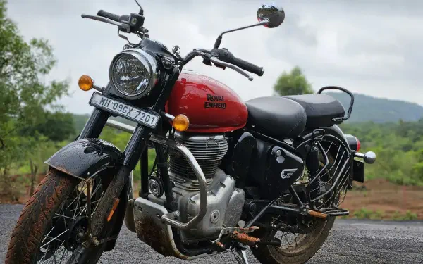 HD desktop wallpaper featuring a Royal Enfield Classic 350 race bike captured in sharp photography against a natural outdoor backdrop.