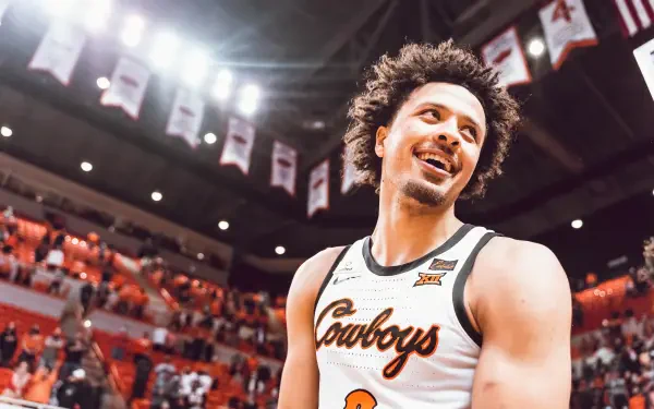 Cade Cunningham smiling on the court during a basketball game, captured in a vibrant 4K Ultra HD PC desktop wallpaper and background.