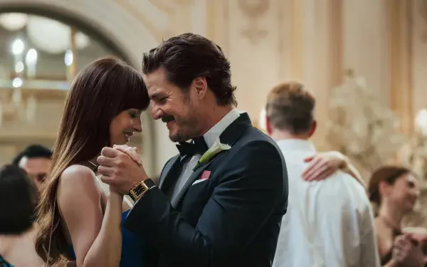 Dakota Johnson and Pedro Pascal share a joyful dance in a scene from the movie Materialists, captured in a 4K Ultra HD desktop wallpaper.