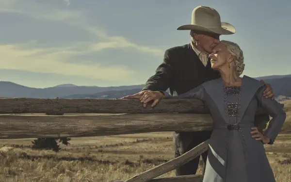 A scenic 8K Ultra HD wallpaper featuring Helen Mirren and Harrison Ford from the TV show 1923, set against a vast rural landscape with mountains in the background.