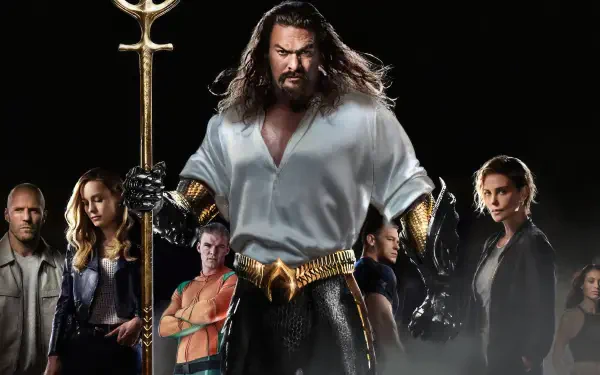 Fast X 4K Ultra HD PC desktop wallpaper and background: poster-style lineup with a towering armored, long-haired hero centered, flanked by a tense ensemble against a dark backdrop.