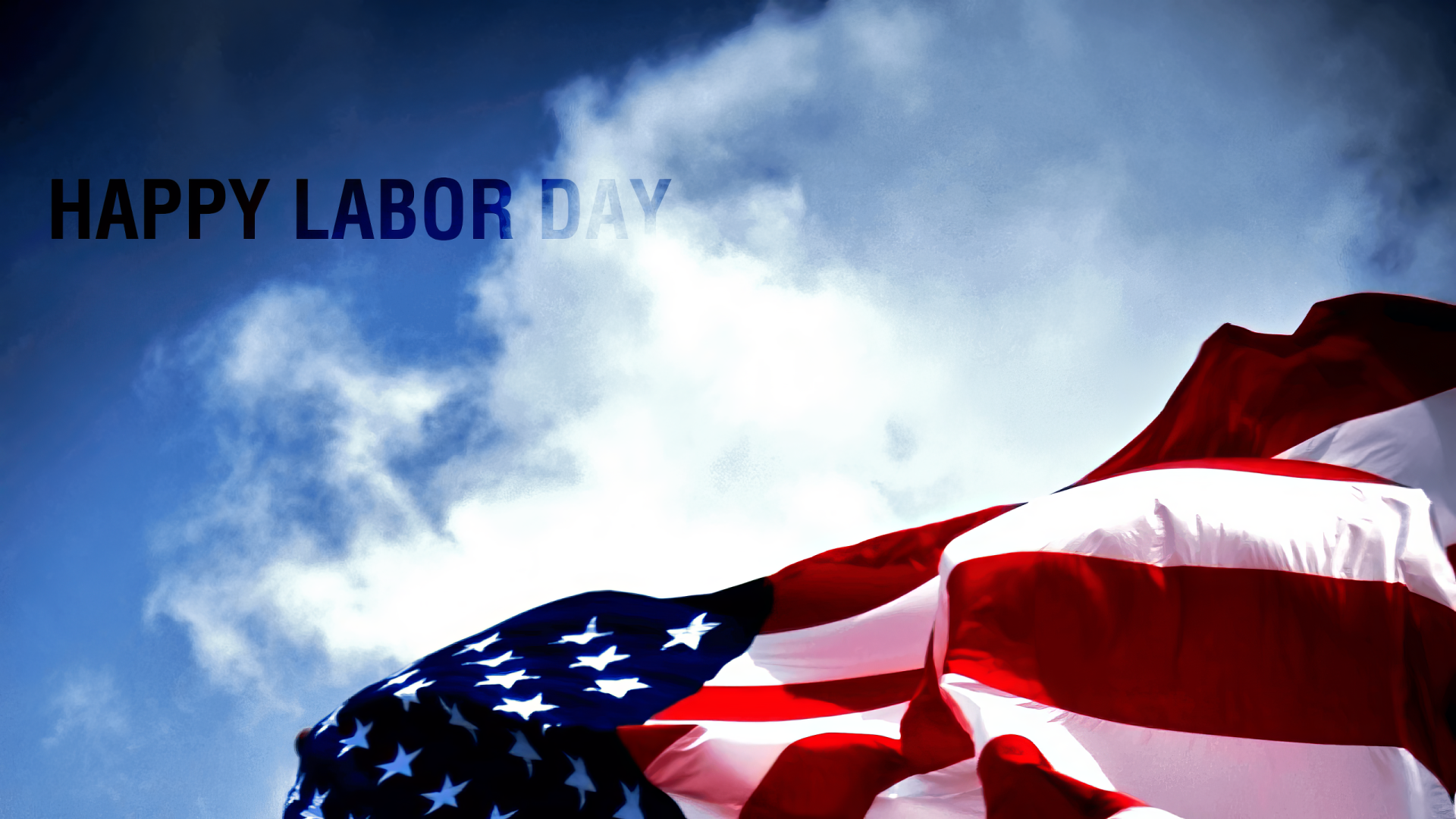 Labor Day HD PC desktop wallpaper and background: American flag waving against a bright blue sky with clouds and Happy Labor Day text.