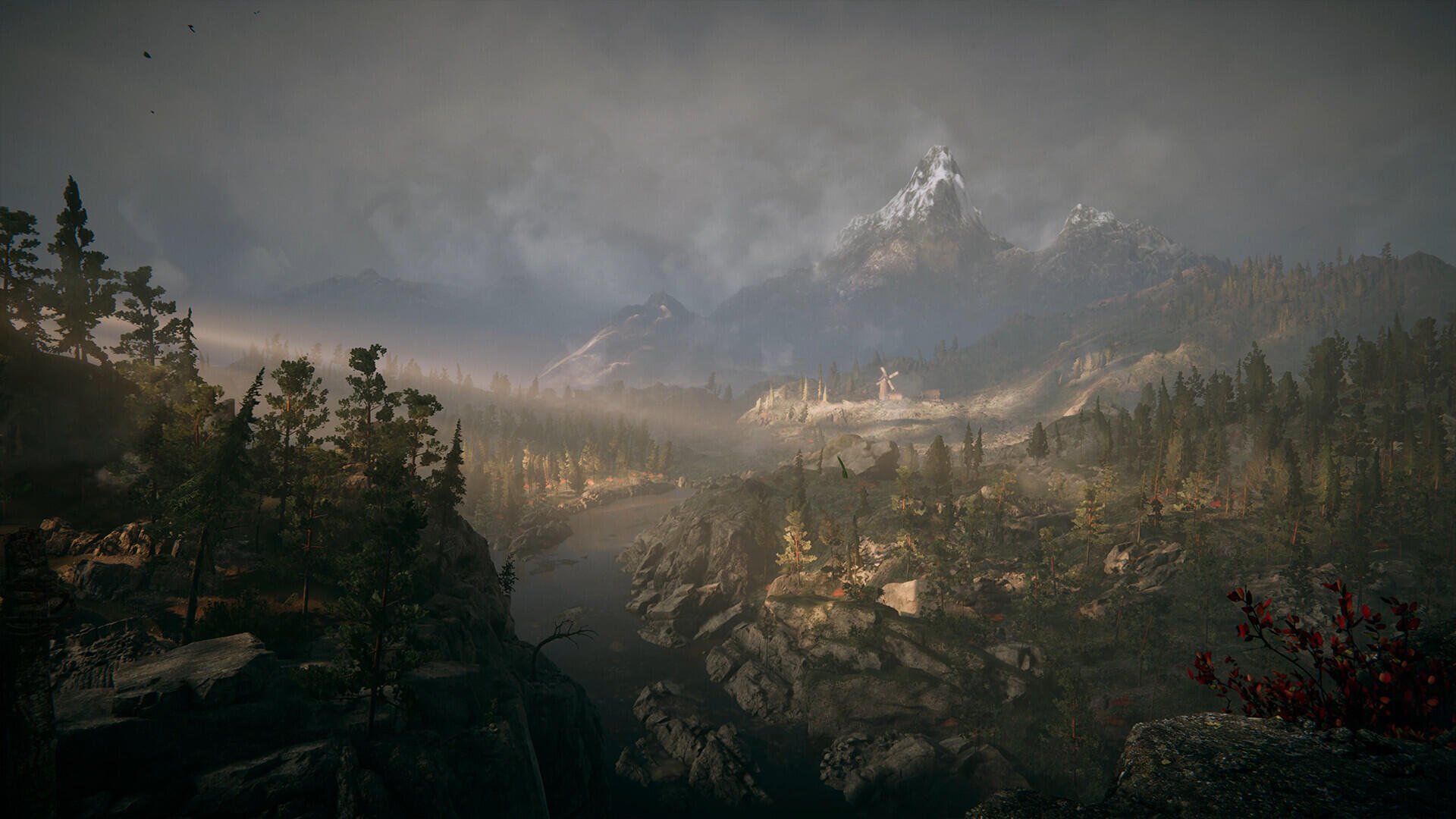 HD PC desktop wallpaper from the video game Alkahest: misty, mountainous valley at dawn with forests, rocky outcrops and a distant snow-capped peak under an overcast sky.
