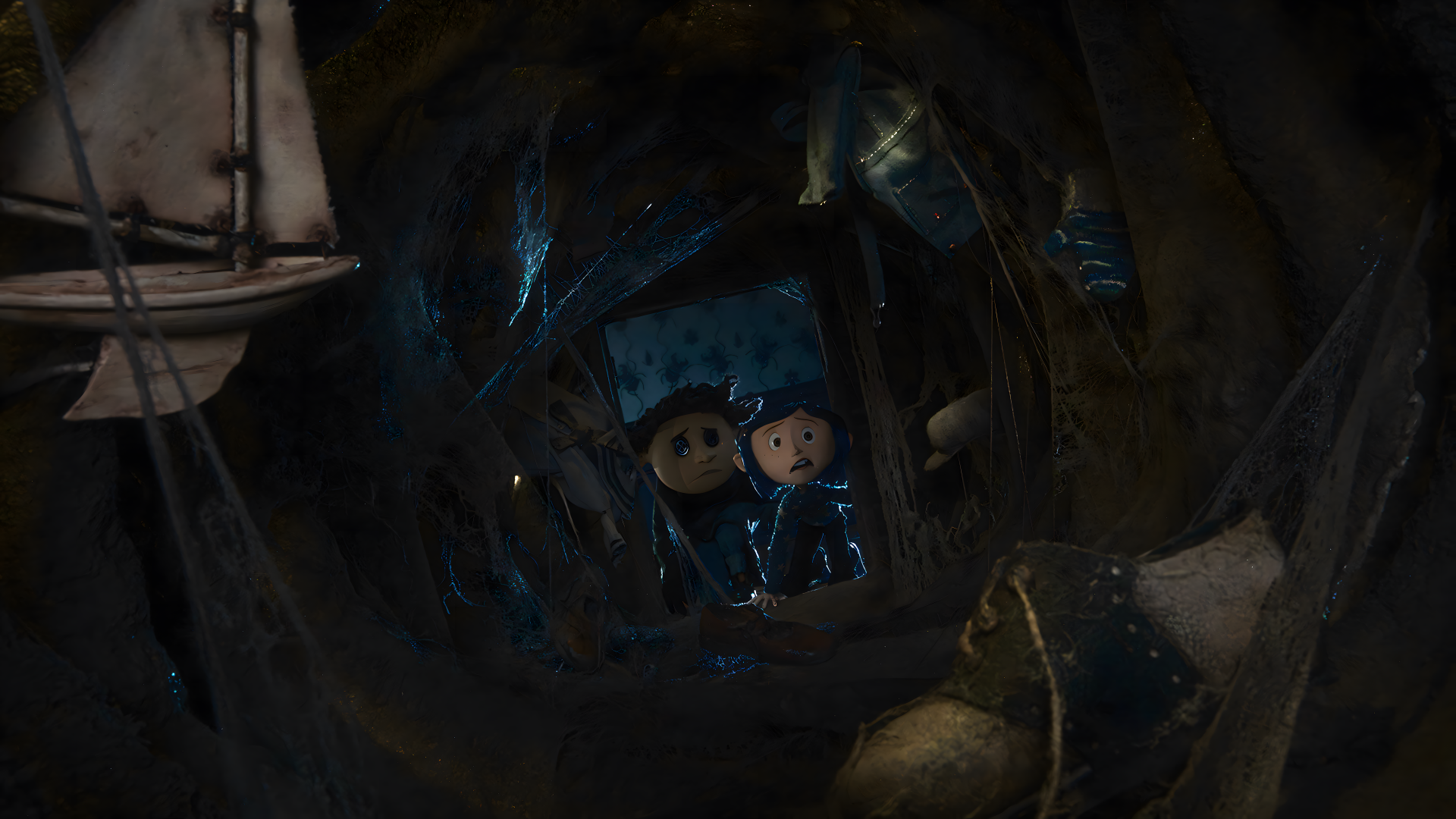 4K Ultra HD PC desktop wallpaper of Coraline Jones from the movie Coraline, peering through a dark tunnel of broken toys and a model ship, lit by eerie blue light.