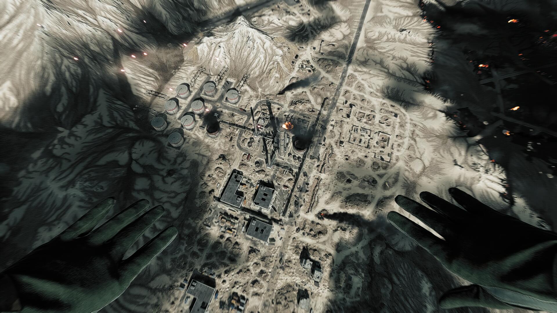 POV aerial view over a war-torn desert map from Battlefield 6, gloved hands framing the scene — 2K Quad HD PC desktop wallpaper and background.