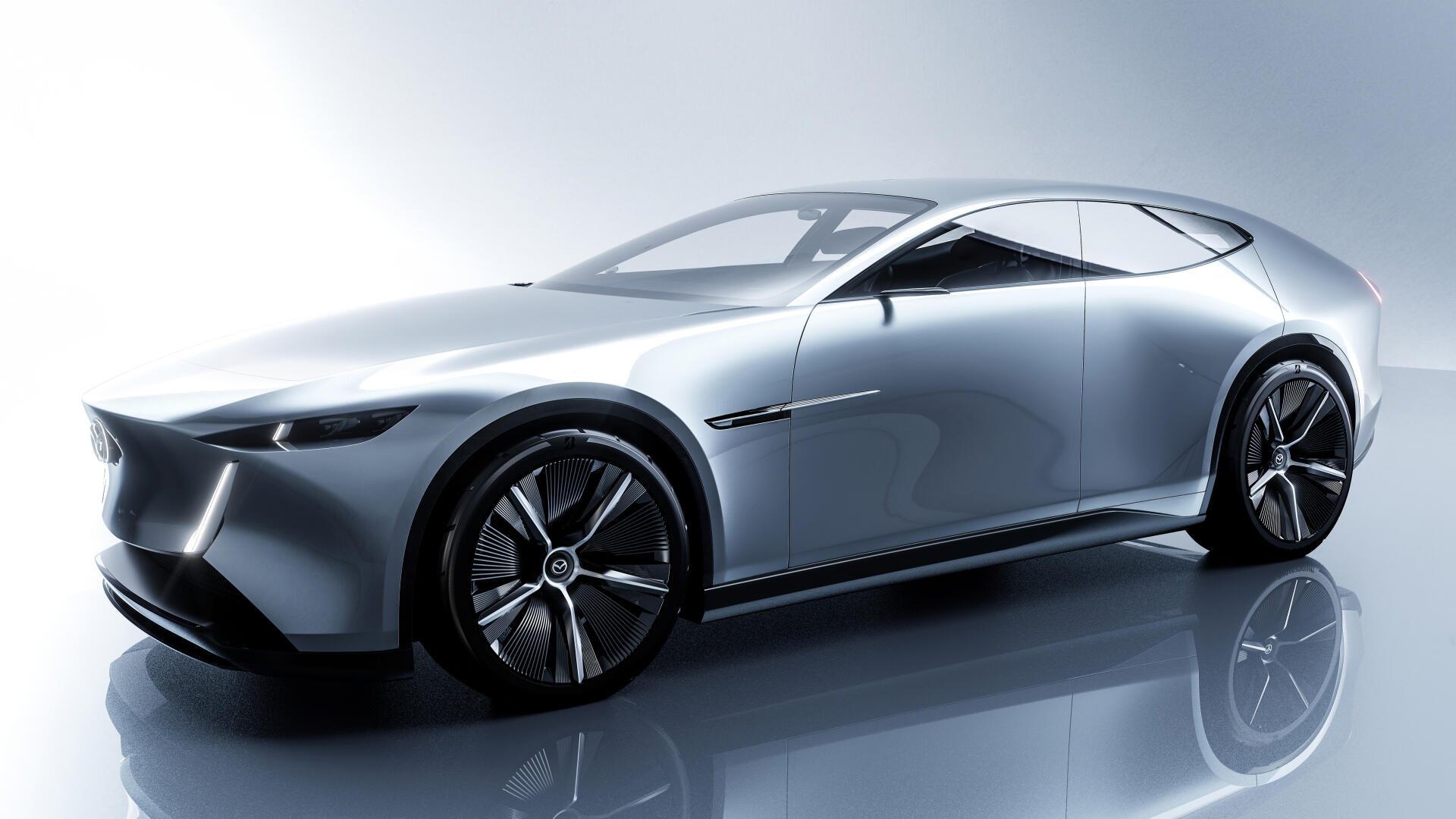 Gray Mazda Vision X-Coupe concept car reflected on a glossy floor — 5K Ultra HD PC desktop wallpaper/background.