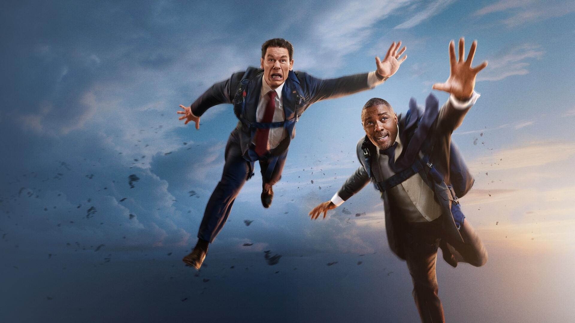 2K Quad HD PC desktop wallpaper: two suited Heads of State tumbling through a dramatic cloudy sky, ties and hands outstretched against sunset light.