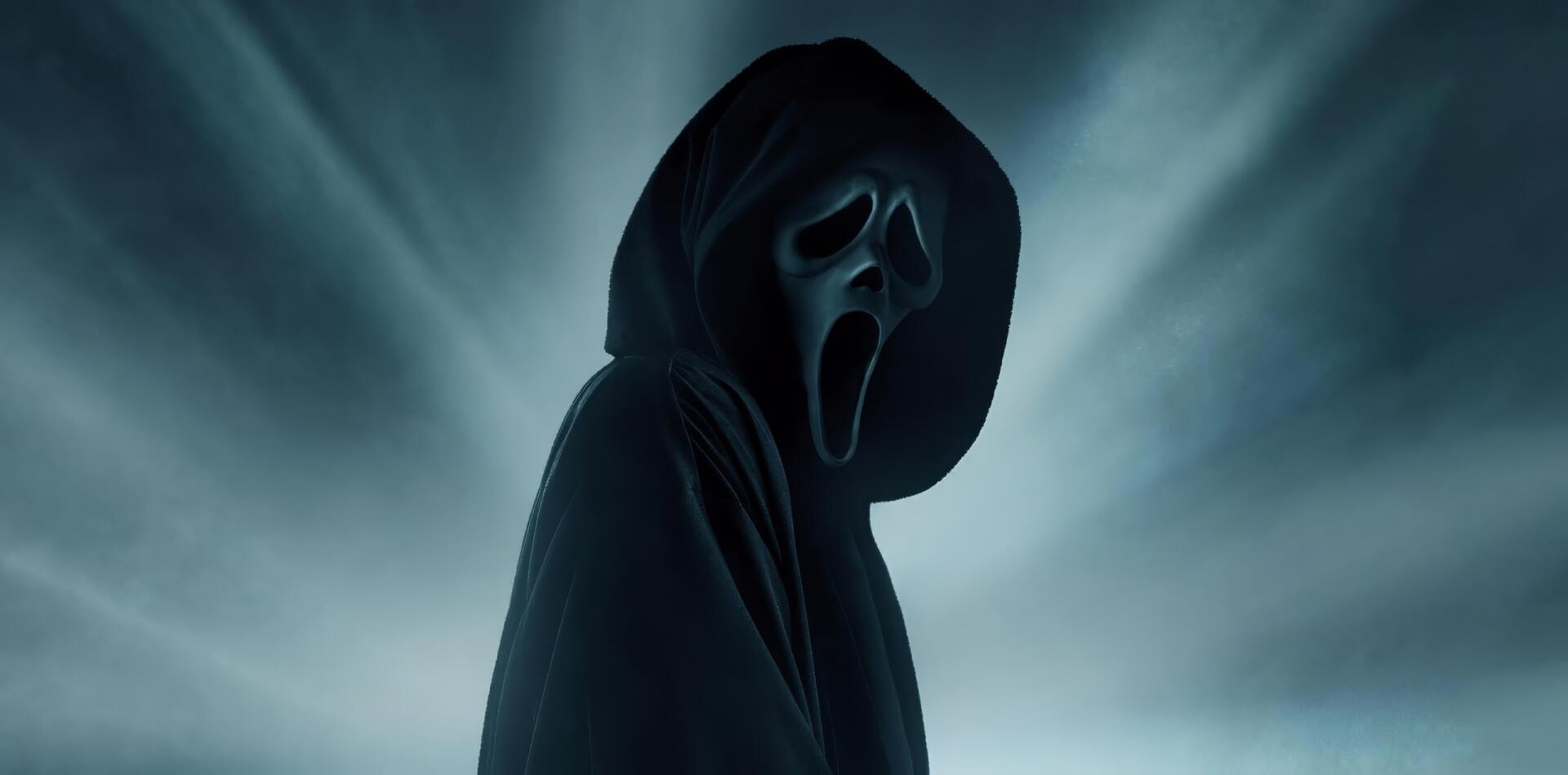 HD PC desktop wallpaper of Ghostface from the movie Scream 7 — a hooded figure with a gaping white mask emerging from eerie blue-gray mist.