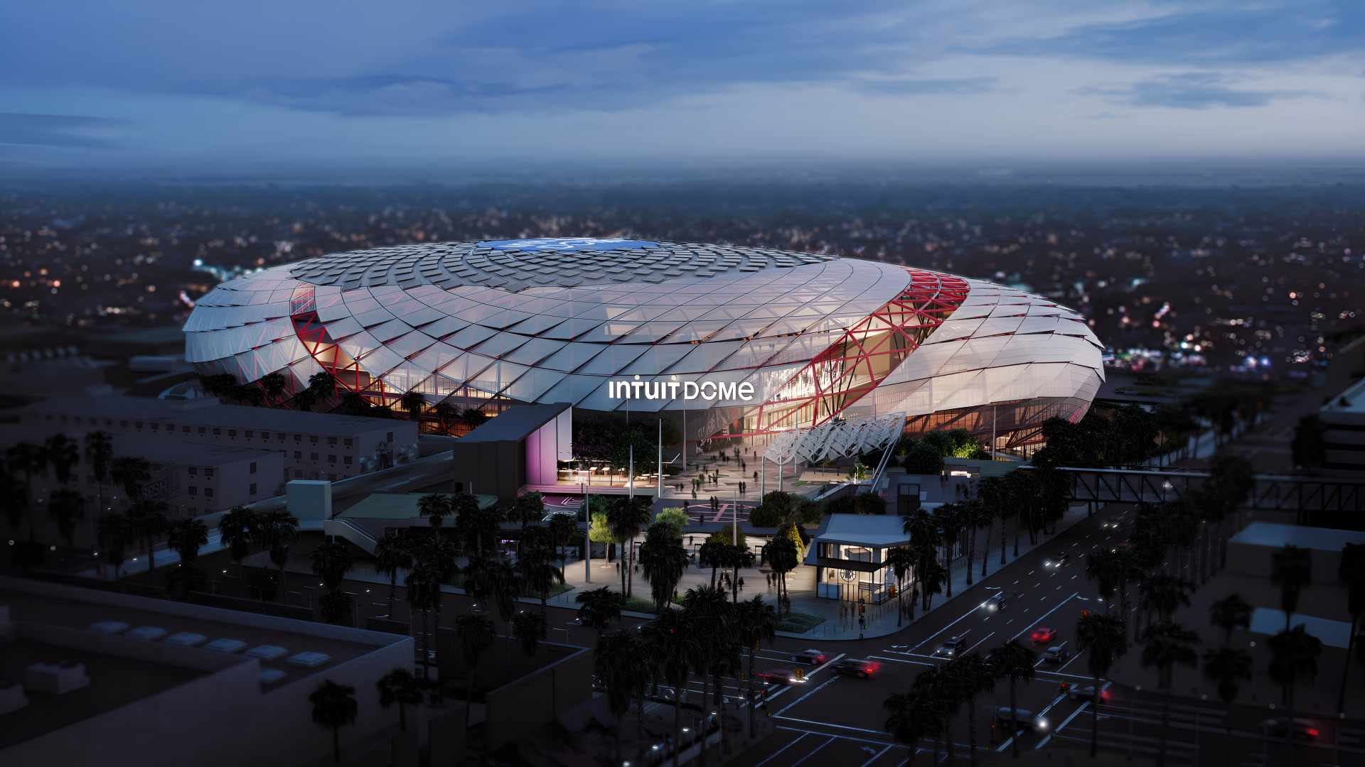 4K Ultra HD PC desktop wallpaper: Intuit Dome in Inglewood, Los Angeles — modern stadium architecture glowing at dusk, aerial view of the arena and nearby streets.
