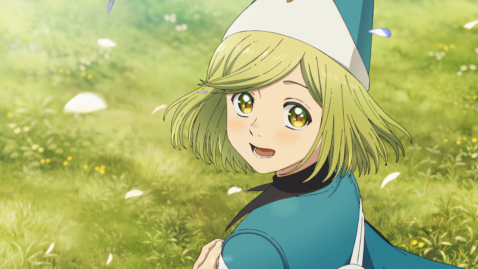 HD PC desktop wallpaper of Coco (Witch Hat Atelier): anime-style portrait of her smiling in a sunlit grassy field, wearing a blue witch hat and cloak with petals drifting around.