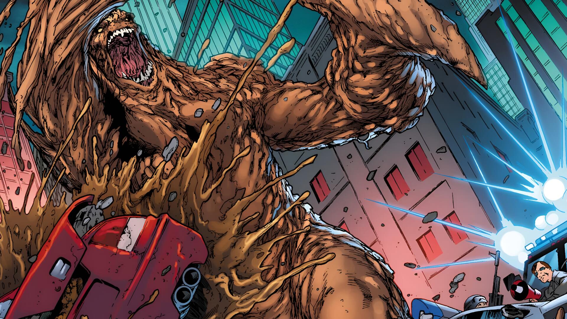 Comic villain Clayface towering over a city, clay limbs crushing a car amid debris and electric blasts — 4K Ultra HD PC desktop wallpaper/background.