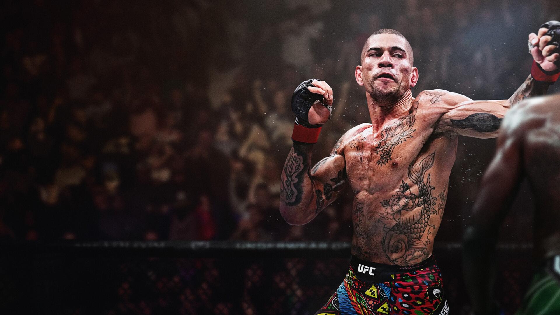 EA SPORTS UFC 6 video game 2K Quad HD PC desktop wallpaper — tattooed MMA fighter in the octagon mid-punch, bloodied face, blurred crowd in the background.