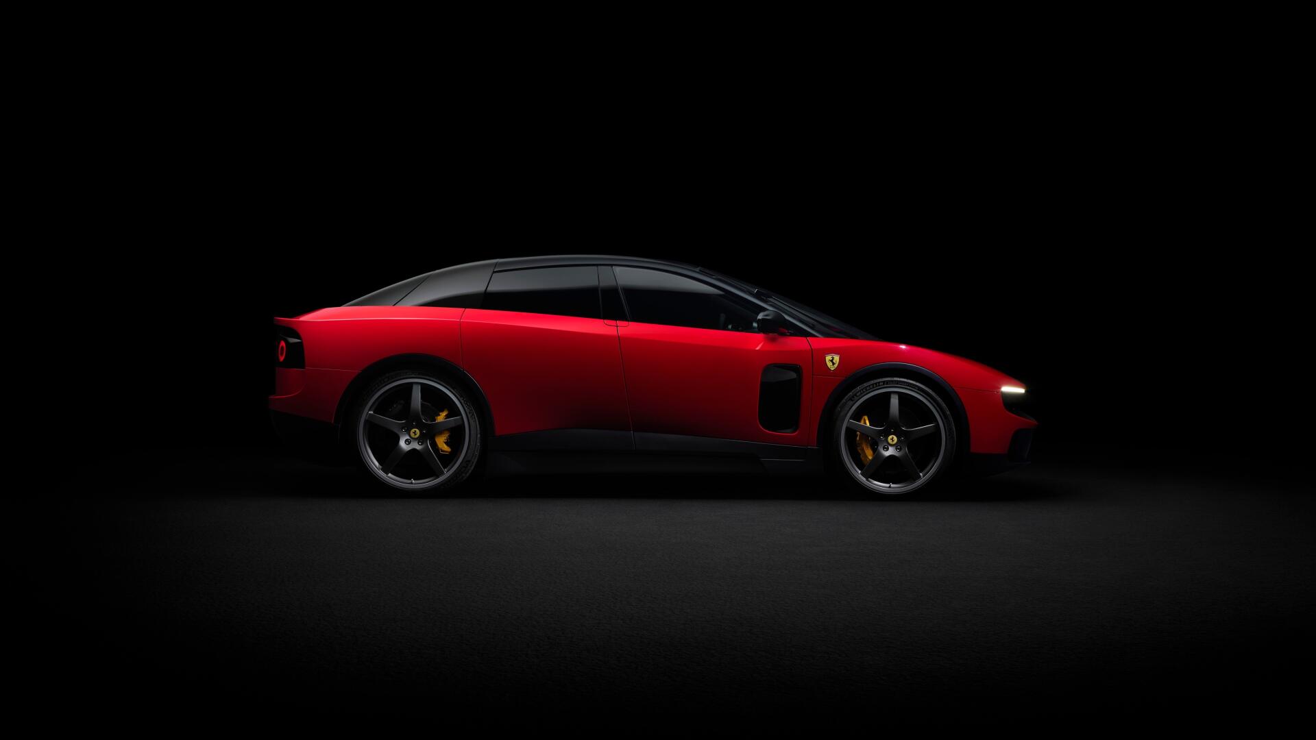 Red Ferrari Luce side profile on a black backdrop, 4K Ultra HD PC desktop wallpaper highlighting the vehicle's sleek silhouette.