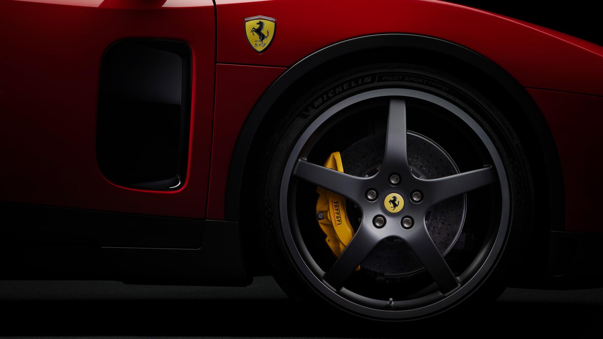 Close-up of a red Ferrari Luce vehicle wheel and yellow brake caliper with prancing horse emblem against a dark backdrop — 4K Ultra HD PC desktop wallpaper.