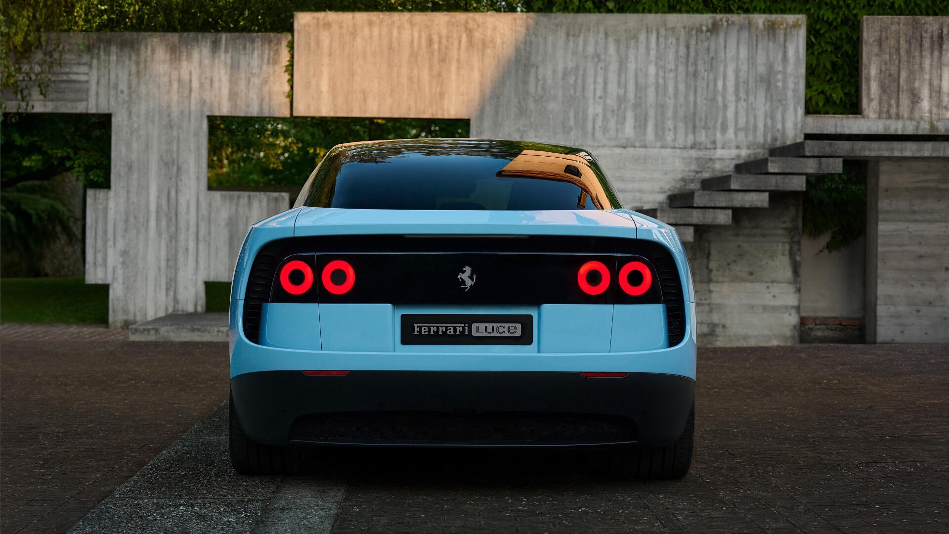 Rear view of a light blue Ferrari Luce parked before concrete modern steps, 4K Ultra HD PC desktop wallpaper background featuring the vehicle's round taillights.