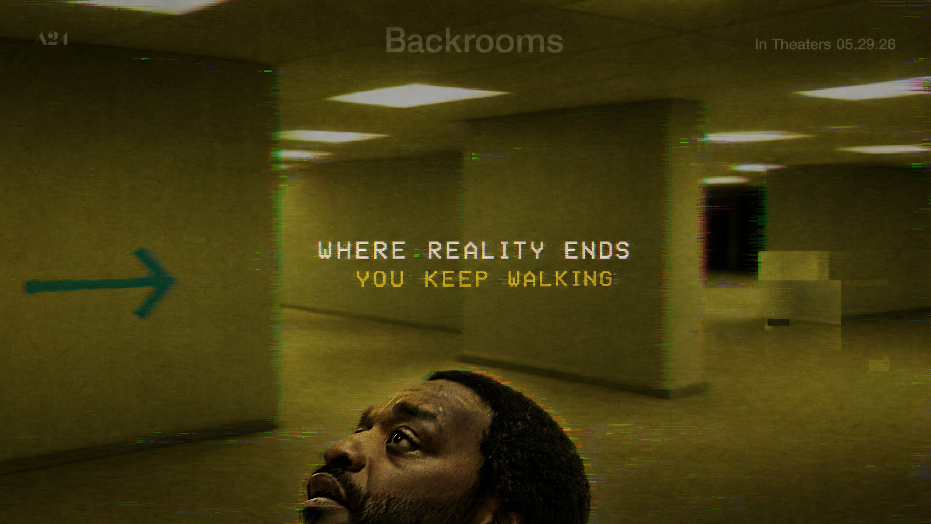 Backrooms 4K Ultra HD PC desktop wallpaper — yellowed fluorescent corridors with a painted arrow, text WHERE REALITY ENDS YOU KEEP WALKING and a man's anxious face in the foreground.