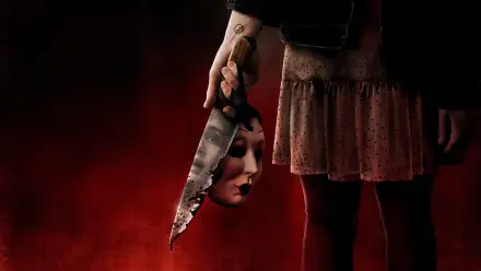 Hand grips a blood-smeared knife holding a pale mask beside a figure's skirt against a dark red backdrop — The Strangers: Prey at Night 5K Ultra HD PC desktop wallpaper and background.