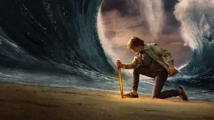 Percy Jackson & the Olympians: The Lightning Thief — 4K Ultra HD PC desktop wallpaper of Percy kneeling on a beach, gripping a glowing sword as a towering wall of water parts.