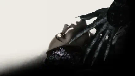 Nosferatu (2024) 4K Ultra HD PC desktop wallpaper and background: shadowed vampire with elongated fingers and a pale face against a stark light-and-dark backdrop.