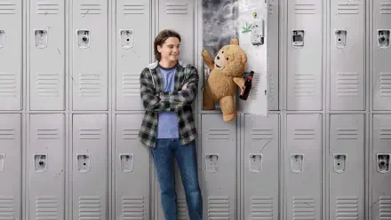 4K Ultra HD PC desktop wallpaper of Ted (TV Show): a smiling teen leans against school lockers as the mischievous teddy bear Ted pops out of a locker holding a snack.