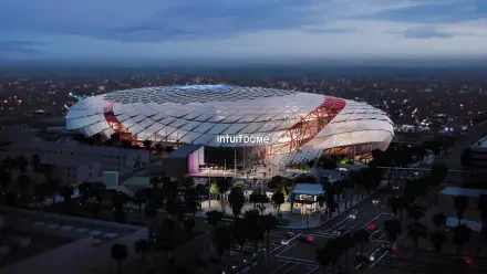 4K Ultra HD PC desktop wallpaper: Intuit Dome in Inglewood, Los Angeles — modern stadium architecture glowing at dusk, aerial view of the arena and nearby streets.