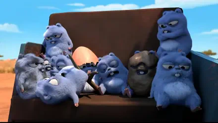 Grizzy and the Lemmings 2K Quad HD PC desktop wallpaper and background — blue, fluffy lemmings clustered on a couch around a large egg with a sunny sky backdrop.