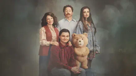 4K Ultra HD PC desktop wallpaper of Ted (TV Show): family-style portrait of three adults and a young man holding the teddy bear Ted against a moody, muted studio backdrop.
