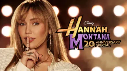 2K Quad HD PC desktop wallpaper for the TV show Hannah Montana 20th Anniversary Special, showing the Hannah Montana character with finger to lips against bright stage lights.