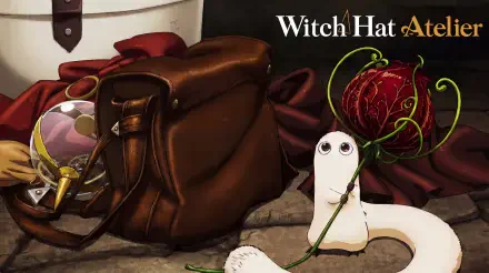 Witch Hat Atelier anime fantasy 5K Ultra HD PC desktop wallpaper: cute white slug-like familiar clutching a rose vine beside a leather satchel and ribbon on a stone floor.