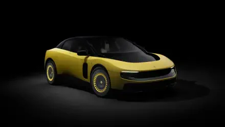 Yellow Ferrari Luce sports vehicle on a black studio backdrop, presented as a 4K Ultra HD PC desktop wallpaper.