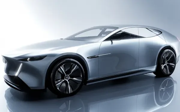 Gray Mazda Vision X-Coupe concept car reflected on a glossy floor — 5K Ultra HD PC desktop wallpaper/background.