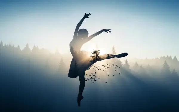 4K Ultra HD desktop wallpaper: silhouetted ballerina leaping, double-exposed with forest and birds against a misty sunrise.