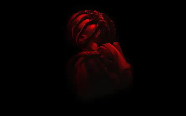 Red-lit Alien: Romulus creature emerging from darkness, cinematic close-up — 4K Ultra HD PC desktop wallpaper/background.