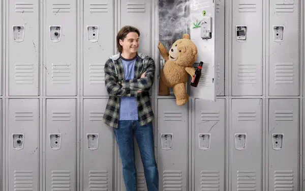 4K Ultra HD PC desktop wallpaper of Ted (TV Show): a smiling teen leans against school lockers as the mischievous teddy bear Ted pops out of a locker holding a snack.