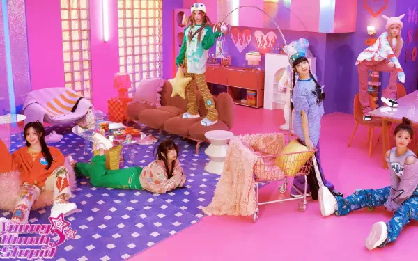 4K Ultra HD PC desktop wallpaper: y2k-inspired K-pop girl band in a bold pink room, colorful outfits and playful retro props.