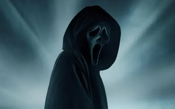 HD PC desktop wallpaper of Ghostface from the movie Scream 7 — a hooded figure with a gaping white mask emerging from eerie blue-gray mist.