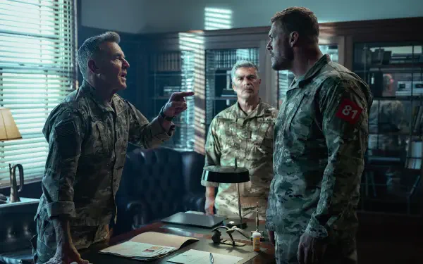 War Machine (2026) movie scene: three uniformed officers in a heated argument across a cluttered office — 5K Ultra HD PC desktop wallpaper/background.