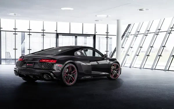 Black Audi R8 RWD luxury car in a bright glass showroom, rendered as an 8K Ultra HD PC desktop wallpaper and background.