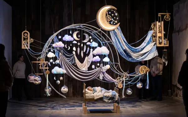 Sleepcore 5K Ultra HD PC desktop wallpaper and background — a surreal bedroom installation: a bed under a glowing crescent, hanging clouds, stars and draped fabric evoking deep sleep.
